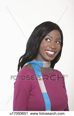 Young, smiling Woman wearing scarf, looking away View Large Photo Image Stock Image - Young, smiling Woman wearing scarf, looking away. Fotosearch