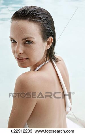 Young woman in swimming pool, portrait View Large Photo Image Stock Image - Young woman in swimming pool, portrait. Fotosearch