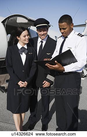 Picture - Aeroplane crew on runway.. Fotosearch