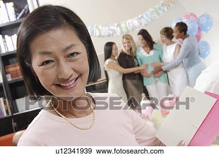Stock Photo - Asian woman at a Baby Shower. Fotosearch