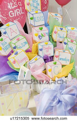 Stock Photography - Baby Shower Gifts and Objects arranged on Table. Fotosearch