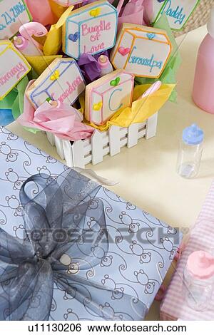 Stock Photograph - Baby Shower Gifts arranged on Table. Fotosearch