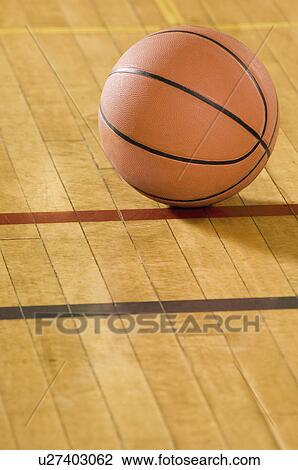 Stock Image - Basketball on court. Fotosearch