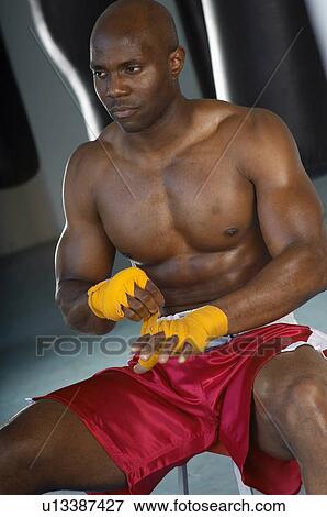 Stock Photo - Boxer Taping Hands Before Fight. Fotosearch
