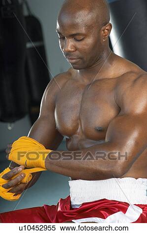 Stock Photography - Boxer Taping Hands Before Fight. Fotosearch