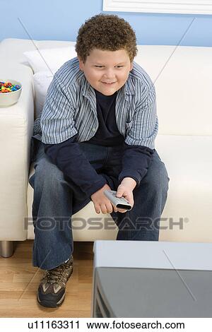 Stock Image - Boy Watching TV. Fotosearch
