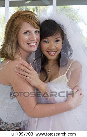 Bride and bridesmaid at bridal shower View Large Photo Image Stock Image - Bride and bridesmaid at bridal shower. Fotosearch