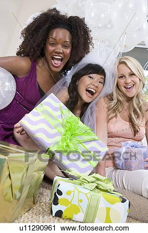 Stock Image - Bride celebrating with friends. Fotosearch