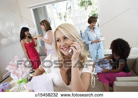 Bride Talking on Cell Phone During Bridal Shower View Large Photo Image Stock Image - Bride Talking on Cell Phone During Bridal Shower. Fotosearch