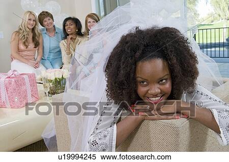 Bride wearing veil with friends at bridal shower View Large Photo Image Stock Photography - Bride wearing veil with friends at bridal shower. Fotosearch