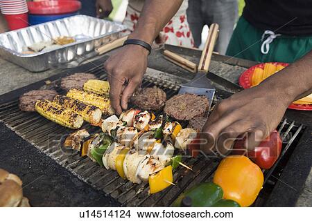 Picture - Burgers and Kebabs on Barbecue Grill. Fotosearch
