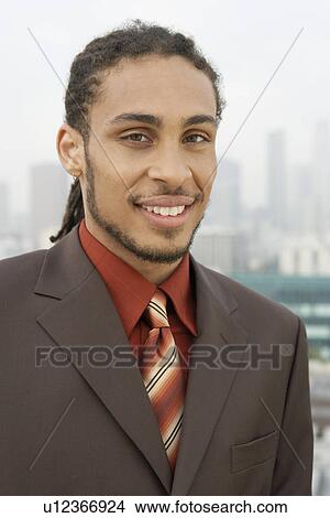 Business man smiling outdoors View Large Photo Image Picture - Business man smiling outdoors. Fotosearch