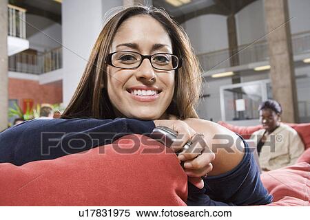 College girl student smiling, sitting on sofa in common room View Large Photo Image Stock Photography - College girl student smiling, sitting on sofa in common room. Fotosearch