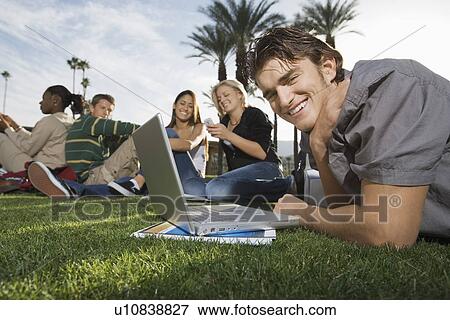 College students on campus studying outdoors View Large Photo Image Stock Photo - College students on campus studying outdoors. Fotosearch