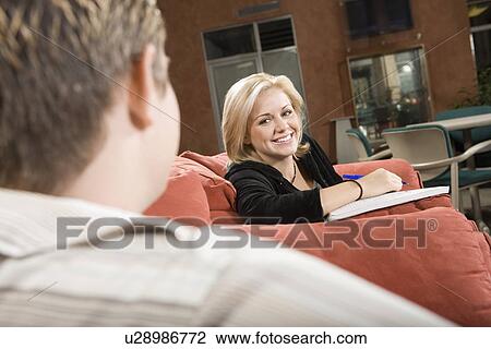 College students sitting in common room together View Large Photo Image Stock Image - College students sitting in common room together. Fotosearch