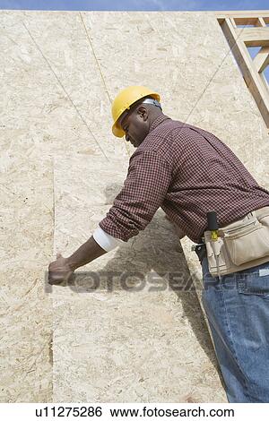 Construction worker at work View Large Photo Image Stock Photograph - Construction worker at work. Fotosearch