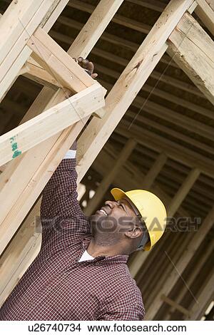 Construction worker measuring building View Large Photo Image Picture - Construction worker measuring building. Fotosearch