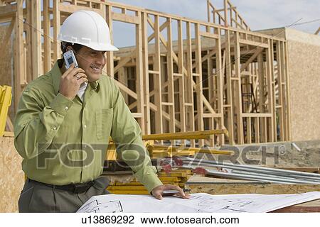 Construction worker using mobile phone View Large Photo Image Stock Image - Construction worker using mobile phone . Fotosearch