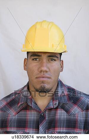 Construction worker wearing hard hat View Large Photo Image Picture - Construction worker wearing hard hat. Fotosearch
