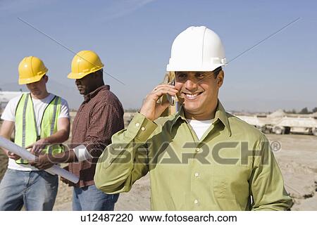 Stock Image - Construction workers on site. Fotosearch
