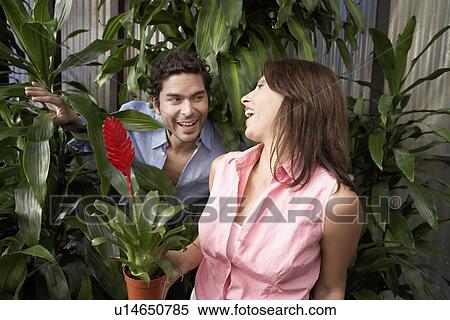Stock Photography - Couple at plant nursery. Fotosearch