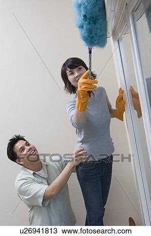 Couple cleaning house View Large Photo Image Stock Image - Couple cleaning house. Fotosearch