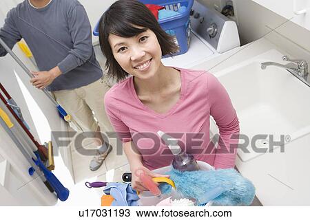 Couple doing housework View Large Photo Image Stock Image - Couple doing housework. Fotosearch