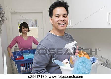Couple doing housework View Large Photo Image Stock Image - Couple doing housework. Fotosearch
