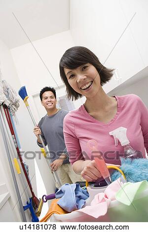 Stock Photo - Couple doing housework. Fotosearch