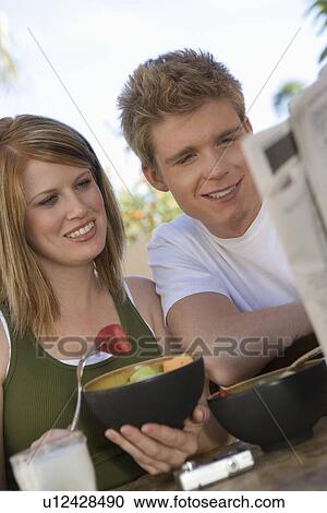 Couple Eating Bowls of Fruit View Large Photo Image Stock Image - Couple Eating Bowls of Fruit. Fotosearch