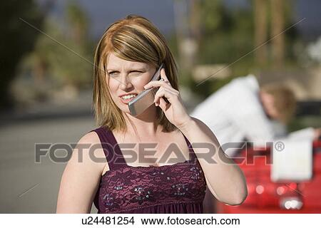 Picture - Couple Having Car Trouble. Fotosearch
