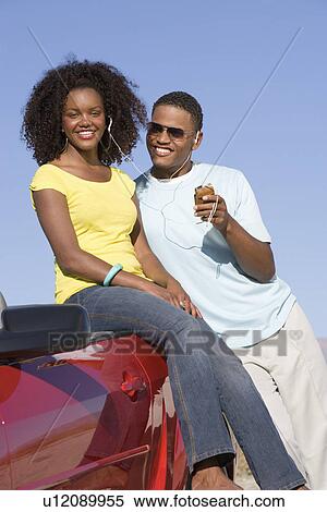 Couple Listening to MP3 Player View Large Photo Image Stock Photography - Couple Listening to MP3 Player. Fotosearch