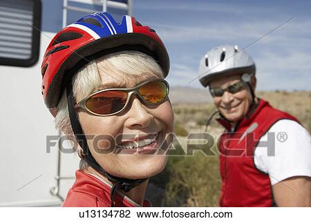 Couple on bicycle ride, portrait View Large Photo Image Stock Image - Couple on bicycle ride, portrait. Fotosearch