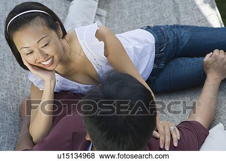 Stock Photo - Couple relaxing in hammock. Fotosearch