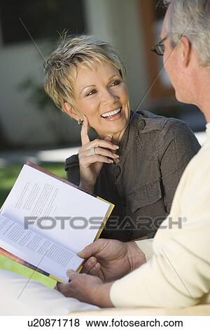 Stock Photo - Couple smiling outdoors. Fotosearch