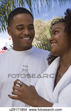 Picture - Couple Standing Outdoors. Fotosearch
