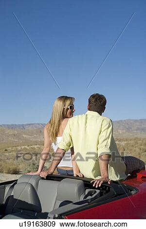Stock Photo - Couple Taking a Break from Driving. Fotosearch