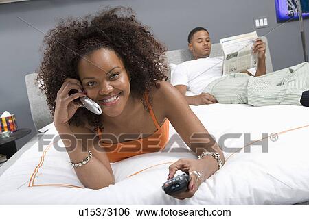 Stock Photograph - Couple Together in Bed. Fotosearch