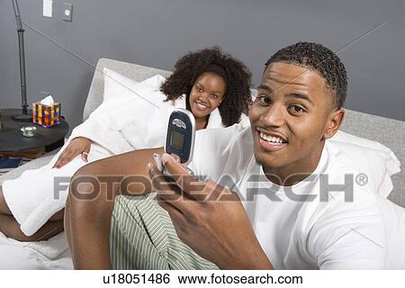 Stock Photograph - Couple Together in Bed. Fotosearch