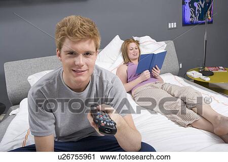 Stock Image - Couple Together in Bedroom. Fotosearch