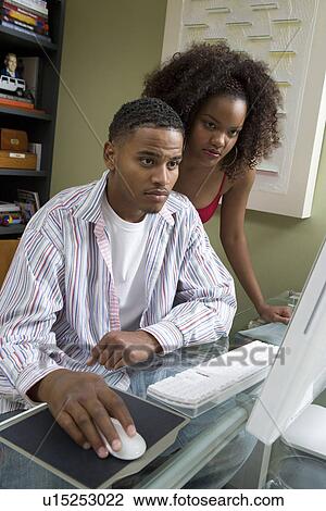 Stock Image - Couple Using Computer. Fotosearch