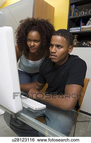 Stock Photograph - Couple Using Computer. Fotosearch