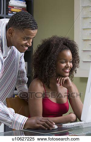 Stock Photography - Couple Using Computer. Fotosearch