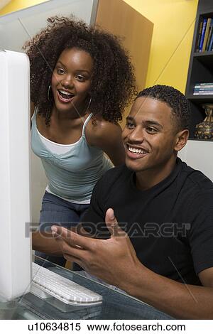 Stock Photography - Couple Using Computer. Fotosearch