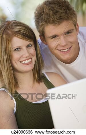 Couple Using Laptop View Large Photo Image Stock Photograph - Couple Using Laptop. Fotosearch
