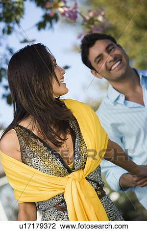 Couple walking in park View Large Photo Image Stock Image - Couple walking in park. Fotosearch