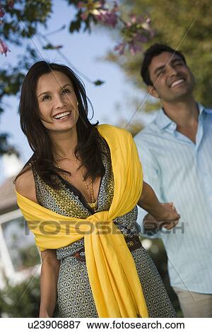 Stock Photo - Couple walking in park. Fotosearch