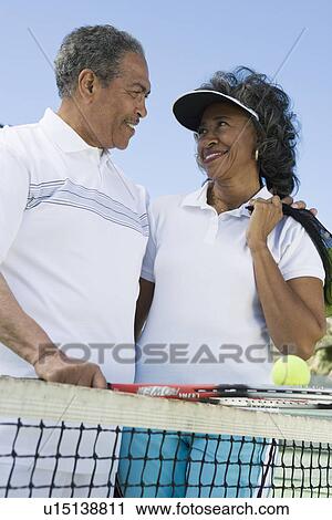 Couple with tennis equipment View Large Photo Image Stock Image - Couple with tennis equipment. Fotosearch