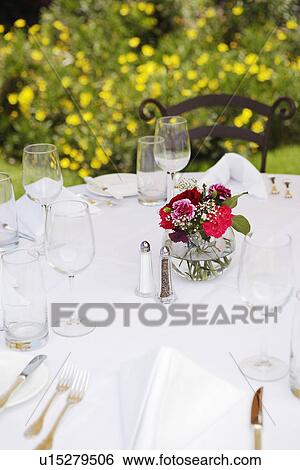 Dining table set in garden View Large Photo Image Stock Photograph - Dining table set in garden. Fotosearch