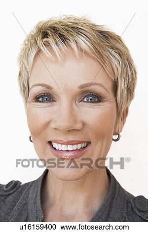 Stock Image - Elegant middle aged woman smiling, portrait. Fotosearch